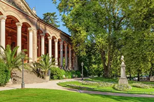 Enjoyment Prints: Visitors enjoy the historical Trinkhalle building with garden space in Baden-Baden on a sunny day in Germany