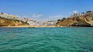 Swimming Prints: Visitors enjoy a sunny day at the beach in Carvoeiro