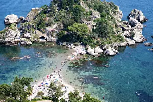 Taormina Prints: Visitors enjoy a sunny day at Isola Bella beach in Sicily with clear water and sandy shore