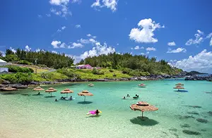 Bermuda Prints: Visitors enjoy a sunny day at Tobacco Bay beach in St Georges Bermuda while snorkeling and swimming in clear water