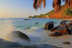 Indigenous Prints: Visitors enjoy the view and activities at Beau Vallon beach on Mahe in Seychelles during sunset hours