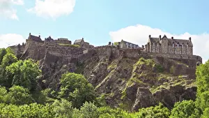Edinburgh Prints: Visitors explore the ancient architecture and history of Edinburgh Castle on a sunny day in Scotland