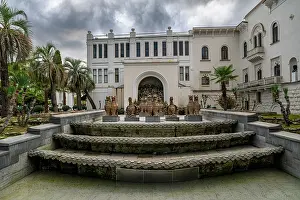 Sculptures Prints: Visitors explore the F.A. Iskander Russian Drama Theater and its surrounding area in Sukhumi
