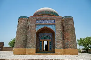 Center Prints: Visitors explore the historic architecture of the Makli Necropole site in Pakistan on a clear day