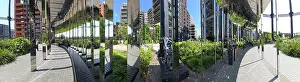 Pedestrian Prints: Visitors explore the park at Old Gas Works in Kings Cross while enjoying the urban landscape in the sun in London