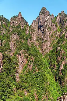 Range Prints: Visitors explore the rugged terrain of Huangshan Mountain while enjoying the diverse landscapes in Anhui Province