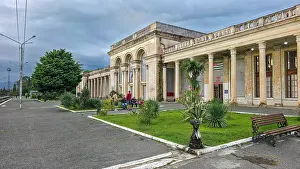 Gardens Prints: Visitors gather outside Gagra railway station in Abkhazia on a cloudy day in Russia