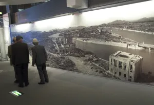 Warfare Prints: Visitors looking at huge wall poster showing the destruction