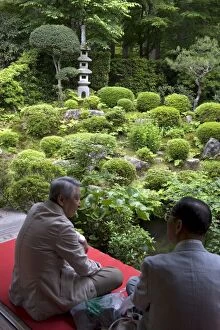 Visitors relaxing at a Zen meditation garden at Sanzenin Temple in Ohara