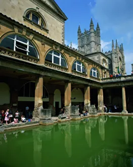 Ancient Civilizations Prints: Visitors in the Roman Baths, with the Abbey beyond in Bath, UNESCO World Heritage Site