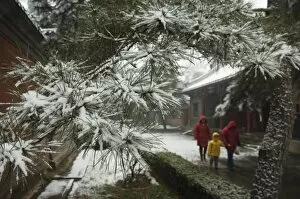 Visitors to a temple after winter snow, Fragrant Hills Park, Western Hills