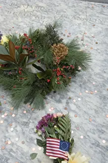Graves Prints: Visitors throw a penny on Benjamin Franklins grave at Christ Church burial ground during celebrations for Benjamin