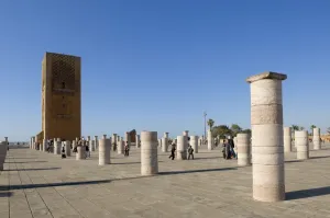 Rabat Prints: Visitors walk among the prayer hall columns of The Unfinished Hassan Mosque
