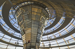 Visitors walk up a spiral ramp around the cone shaped funnel in the dome cupola Visitors walk up a spiral ramp around the cone shaped funnel in the dome cupola