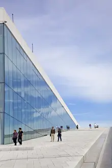 Opera Houses Prints: Visitors walking outside the Oslo Opera house exterior in summer sunshine