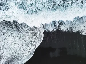 Sand Beach Prints: Volcanic Black Sand Beach with a view of Reynisdrangar
