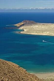 Images Dated 19th November 2005: Volcanic cinder cone on Graciosa Island and the Graciosa to Lanzarote ferry in the Rio strait
