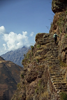 Pisac Prints: A walker climbs the steps on a narrow path along