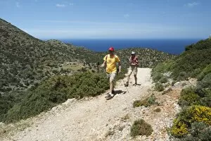 Walkers on coastal walk, Akrotiri Peninsula, Chania region, Crete, Greek Islands, Greece, Europe