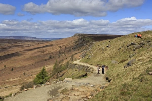 Walkers, Stanage Edge, on a fine spring day, near Hathersage, Peak District National Park