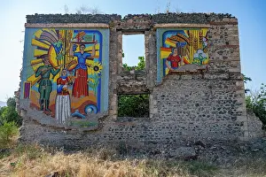 Identity Prints: Wall mural displays colorful scenes on ruined structure in Aghdam