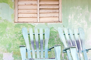 Absence Prints: Detail of wall and rocking chair with faded paintwork in green and blue