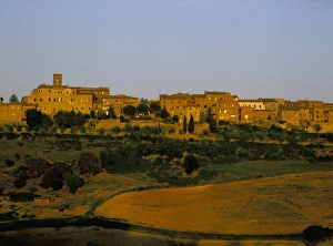 Hill Village Prints: Walled hill village at dusk