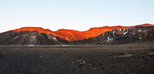 Australasia Prints: Walls of Tongariro Volcano lit by red sunrise