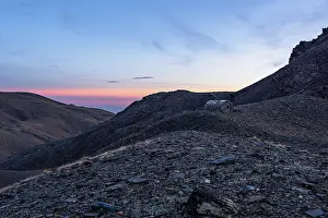 Charm Prints: Warm sunset light casts shadows on rocky ridges near Cerro del Caballo in Sierra Nevada National Park