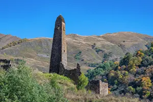 Terrain Prints: Watchtower in remote mountains of Chechnya stands against clear blue sky