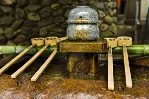Japanese Script Prints: Water dipper in the Endless Red Gates of Kyotos Fushimi Inarii Shrine, Kyoto, Japan, Asia