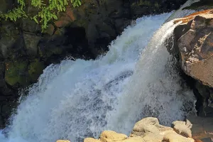 Relaxing Prints: Water flows over rocks at Beau Champ Waterfall in Southern Mauritius during daylight hours