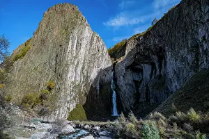 Flowing Prints: Water flows from Sultan waterfall surrounded by high cliffs near Mount Elbrus in Kabardino-Balkaria