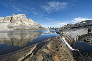 Falls Prints: Waterfall and reflection of mountains in Laguna de la Plaza, El Cocuy National Park