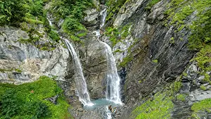 Waterfalls Prints: Waterfalls cascade down rocky cliffs in Tschinglengorge in Sardona National Park