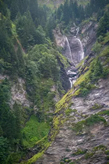 Waterfalls Prints: Waterfalls flow through Tschinglengorge in Sardona National Park during a cloudy day in Switzerland
