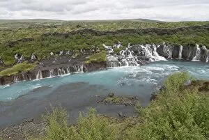 Waterfalls flowing down the rocks Hraunfossar, Iceland, Polar Regions