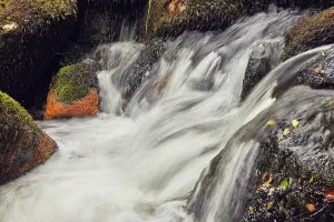 Ripples Prints: Waters flow over rocks in Dart Valley Nature Reserve in Dartmoor National Park