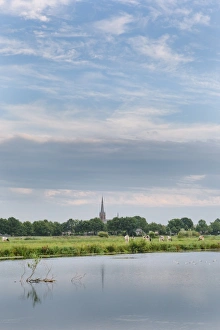 North Brabant Prints: Still waters of the River Mark with Ulvenhout church in the distance