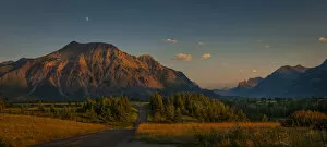 Rural Road Collection: Waterton-Glacier mountains at sunset, UNESCO World Heritage Biosphere site with a lone