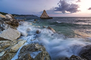 Marche Prints: Waves of blue sea framed by the pink sunrise, La Vela Beach, Portonovo, province of Ancona
