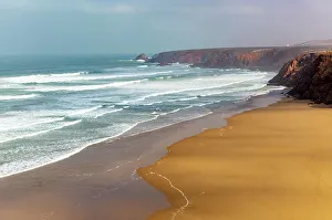 Waves Crashing Prints: Waves breaking coastal cliffs and sandy beach