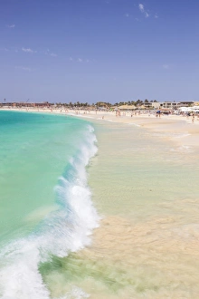 Waves breaking on the sandy beach in Santa Maria, Praia de Santa Maria, Baia de Santa Maria