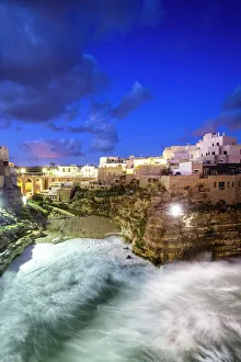 Light Beam Prints: Waves crash on the beach during a winter storm, Polignano a Mare, Apulia, Italy, Europe