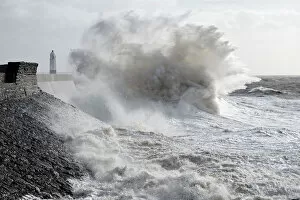 Lighthouse Gallery: Waves crash against the harbour wall at Porthcawl, Bridgend, Wales, United Kingdom