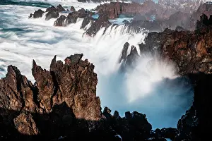 Turbulent Prints: Waves crash against rocky shores in Porto Moniz