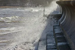 Channel Prints: Waves crash against the sea wall on the coast of the English Channel in Teignmouth