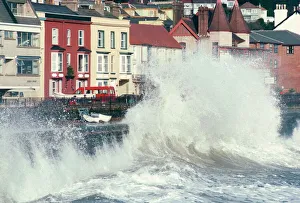 Stormy Prints: Waves pounding sea wall and rail track in storm, Dawlish, Devon, England