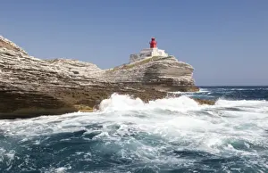 White Cliffs Prints: Waves of the turquoise sea crashing on the granite white cliffs and lighthouse