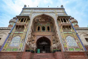 Artistry Prints: Wazir Khan Mosque shows intricate tile work and architectural features in Lahore Pakistan during the day